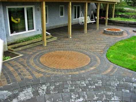Custom designed and built by archadeck of chicagoland. Large Brick Patio with Firepit - Morgan K Landscapes