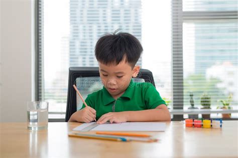 Cute Boy Is Drawing Using Color Pencils Isolated Over White Stock