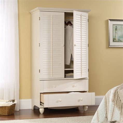 Wardrobe armoires are a fantastic addition to any bedroom that is short on space. Sauder Harbor View Armoire in Antiqued White - 158036