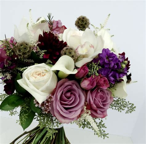 Her favorite flowers, colors and style all get included in this stunning. Bridal bouquet by Krueger Floral - Schofield Wisconsin ...