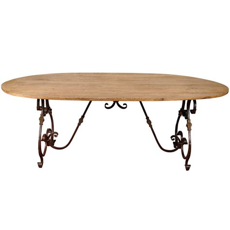 We promise to only send good things. French Oval Metal Base Dining Table at 1stdibs