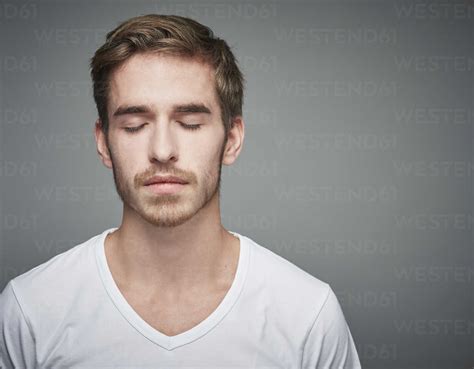 Portrait Of Young Man With Closed Eyes Stock Photo