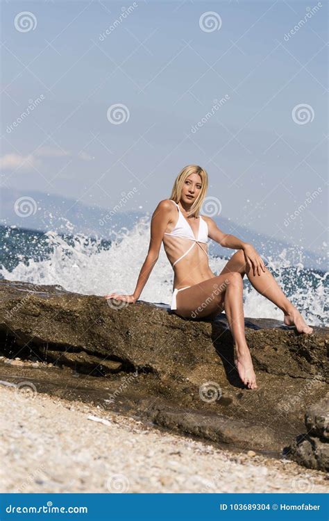 Londe Woman Sitting On Sea Rocks Stock Photo Image Of Full Bikini