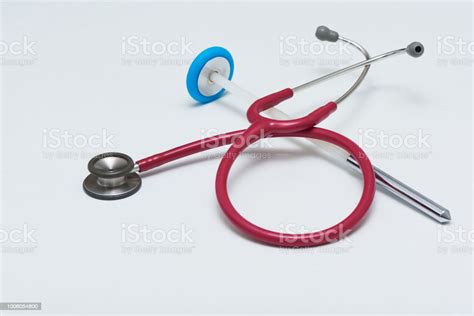 A Stethoscope And Reflex Hammer On The Table Stock Photo Download