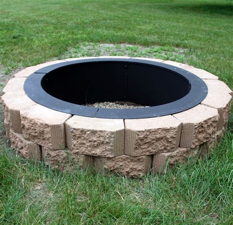 Portable fire pit rings allow you to start a safe, warm fire anywhere in your backyard all summer long. Sunnydaze Decor 27-inch Fire Ring - In-Ground Fire Pit