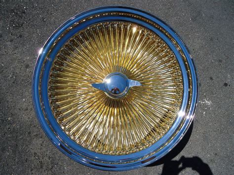 Elegant Dayton Gold Chrome Wire Wheels