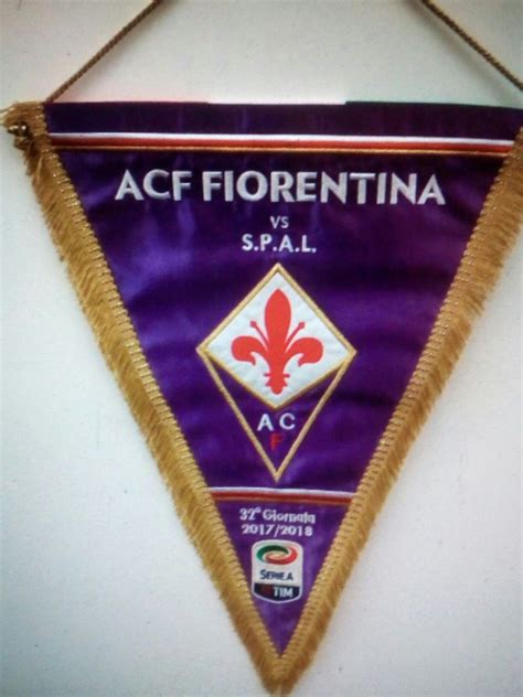 A Pennant Hanging On The Wall That Says Ace Fiorentina Vs Spal
