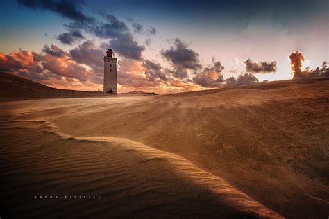 lighthouse at sunset rubjerg knude fyr denmark artur filipiak flickr