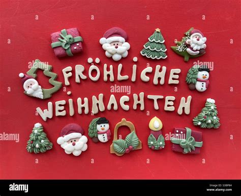 Fröhliche Weihnachten Merry Christmas In German Language With Wooden Letters And Marzipan