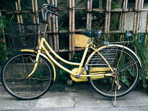 Vintage Yellow Bike In Japanese Street By Stocksy Contributor Rowena Naylor Stocksy