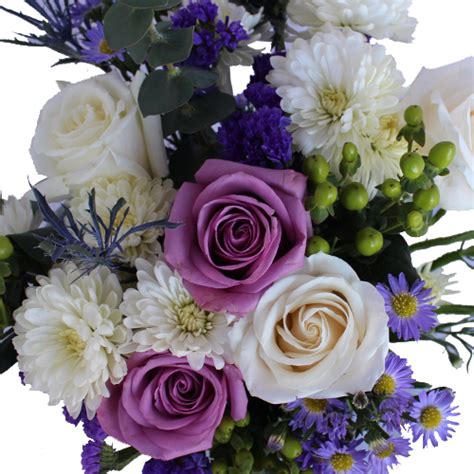Pale blue hydrangea bouquet accented with pink garden roses and little clouds of babies breath. Purple and White Wedding Centerpieces