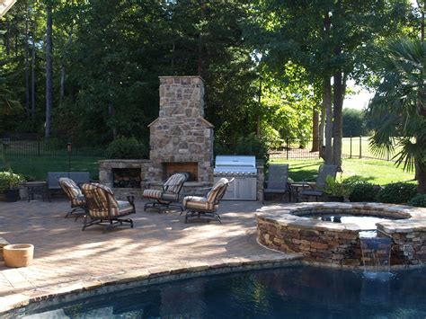 Tumbled Cobblestone Concrete Paver Pool Deck And Patio With Stone Faced