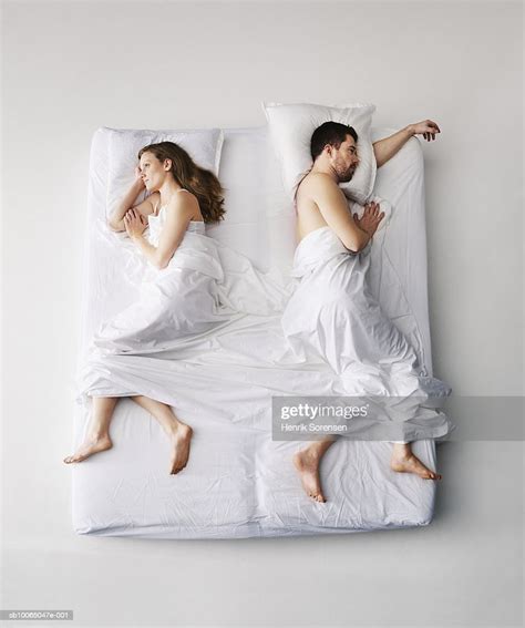 Mid Adult Couple Sleeping In Bed Elevated View Photo Getty Images