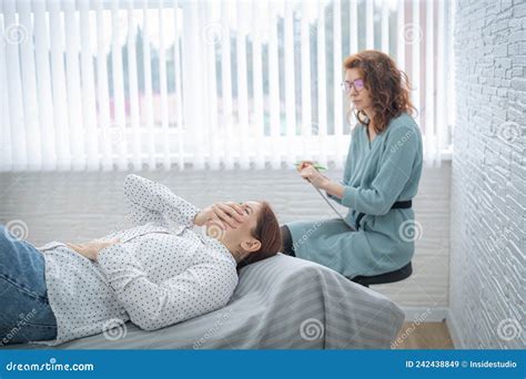 Caucasian Woman Crying While Lying On The Couch At A Session With A