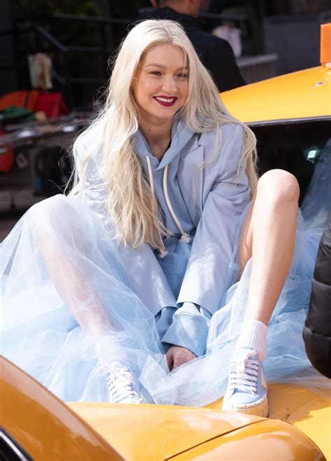 Gigi Hadid Spreads Legs In Blue Tulle Skirt Atop Taxi For New