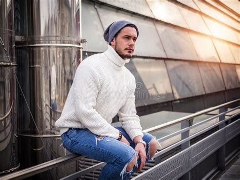 One Attractive Man In City Setting Wearing White Sweater Stock Image