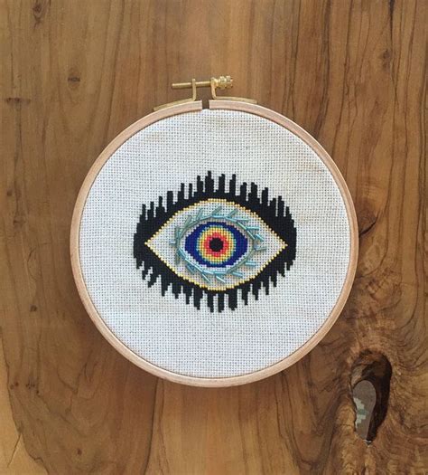 If you are invited to a wedding this summer make sure you come with a unique gift in hand and not just the boring toaster. Beaded Evil Eye cross stitch pattern | modern cross stitch ...