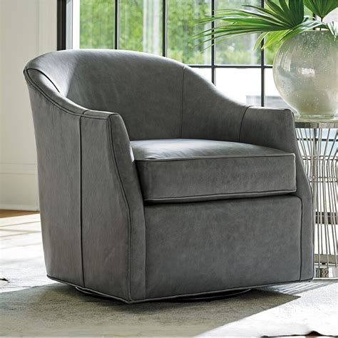 Something about a leather chair feels so classic. Lexington Ariana 29.5" W Faux Leather Swivel Barrel Chair