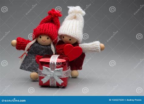 Two Dolls In Love On Valentines Day Knitted Wear With Heart Stock Photo