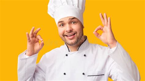 Happy Chef Man Gesturing Ok Standing On Yellow Background Panorama
