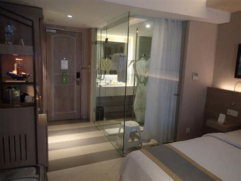 White and gray bedding completes the bed design. Glass Wall Bathroom - Picture of SenS Hotel & Spa ...