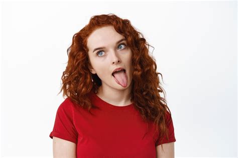 Free Photo Portrait Of Silly Ginger Girl Showing Tongue And Fool Around Making Funny Faces
