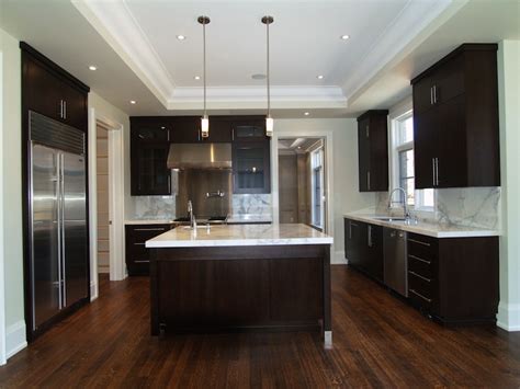 The white upper cabinets combined with the white subway tile keeps things feeling open and airy. Espresso Kitchen Cabinets - Contemporary - kitchen ...