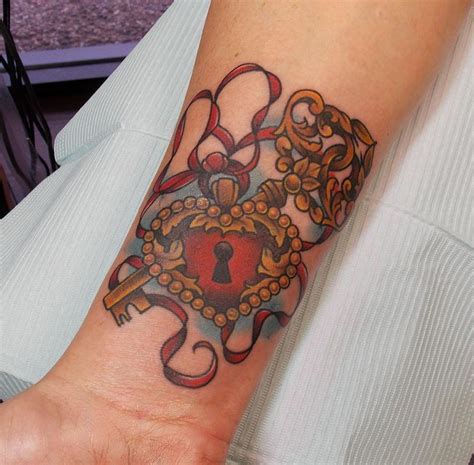 Lock and key tattoos are intricately decorated just like in the lock and key tattoo design below that's enriched with flowers and jewels. Heart Locket Tattoos Designs, Ideas and Meaning | Tattoos ...