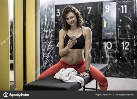 Athletic Woman Posing In Locker Room Stock Photo Bezikus