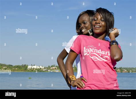 Two Young African Women Smiling Half Portrait Kampala Uganda