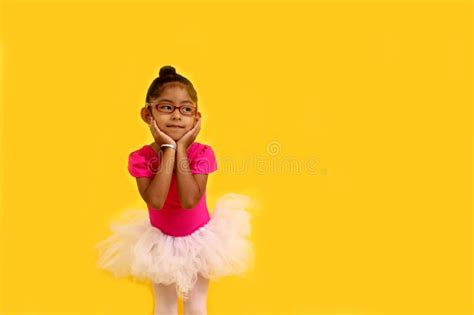 4 Year Old Brunette Latina Girl With Eyeglasses Dressed In Leotard And