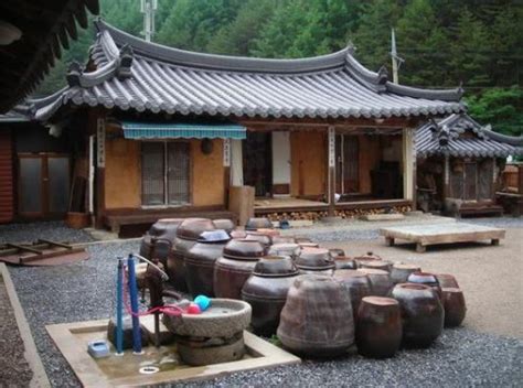 These traditional houses are called hanok (한옥) and some which are over 500 years old still in south korea, there are several hanok villages in which hanok have been preserved for tourists to visit. Try a Traditional Korean Guest House!!