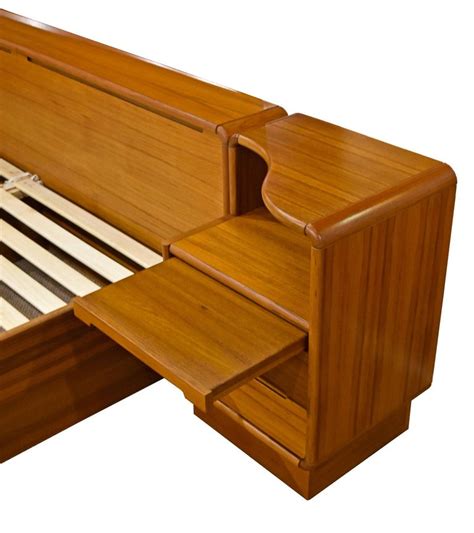 One way to make your room look polished and modern is to invest in a floating headboard with attached nightstands as they maximize your floor space. Scandinavian Modern King Teak Platform Bed with ...