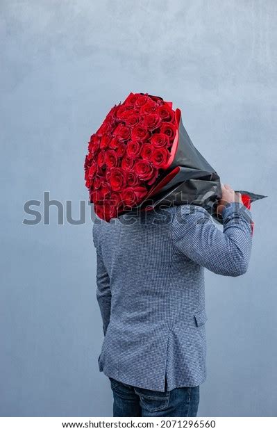 Young Man Suit Holds Large Bouquet Stock Photo 2071296560 Shutterstock