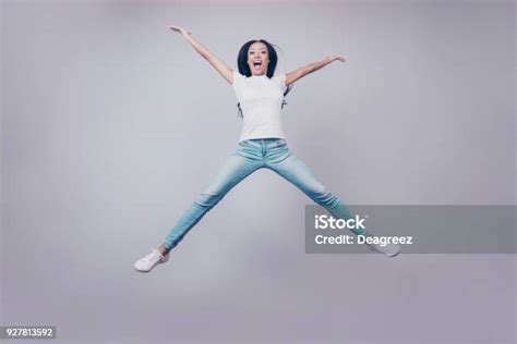 Excited Mixed Race Brunette Lady Model Is Jumping Spreading Arms And