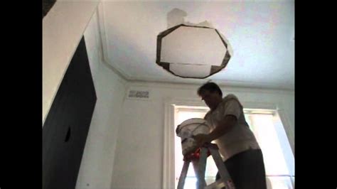 Shove it through the hole, position it and hold it down(using the not yet tight screw). Plastering Repair of a Big Hole in The Ceiling P 2 - YouTube
