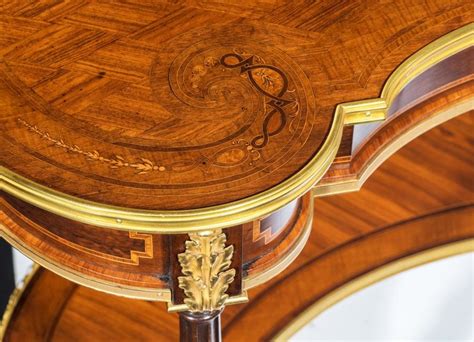Unusual kidney shaped desk made with high detailed mahogany woods,showing two pull out draws,and two pull out trays left and right.beautiful piece. Exquisite Parquetry Kidney Shaped Table by Gillows | BADA