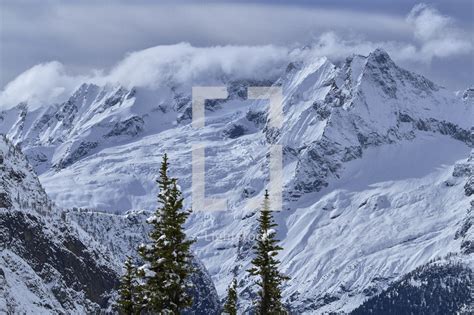 Jagged Snow Covered Mountain Peaks — Photo — Lightstock
