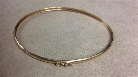 Maybe you would like to learn more about one of these? 10 karat yellow gold bangle bracelet
