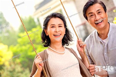 Elderly Couple On The Swings Stock Photo Picture And Royalty Free