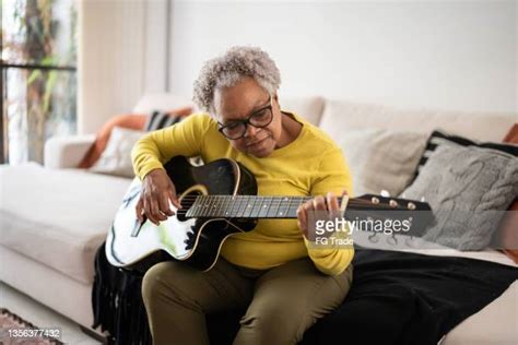 Old Woman Playing Guitar Photos And Premium High Res Pictures Getty