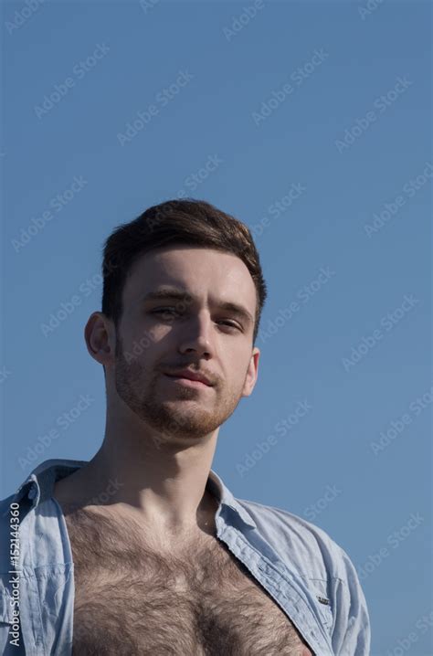 Handsome Man Posing In Unbutton Shirt With Naked Hairy Chest Stock Photo Adobe Stock