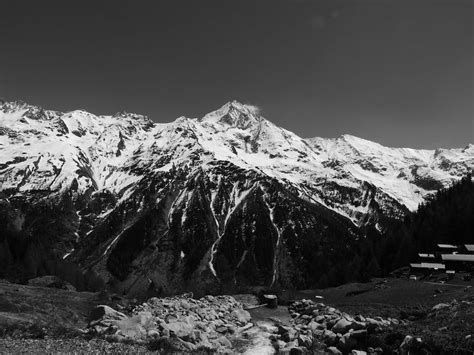 Grayscale Photo Of Snow Covered Mountains · Free Stock Photo