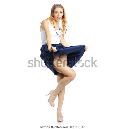 Photo De Stock Surprised Girl Lifts Her Skirt 181324547 Shutterstock