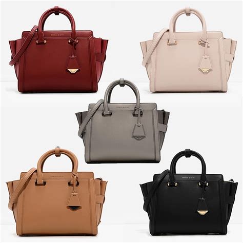 An accessible brand with genuine kudos, charles & keith has put the creativity back into affordable accessories. Charles & Keith city handbag top zip handle bag Trapeze ...