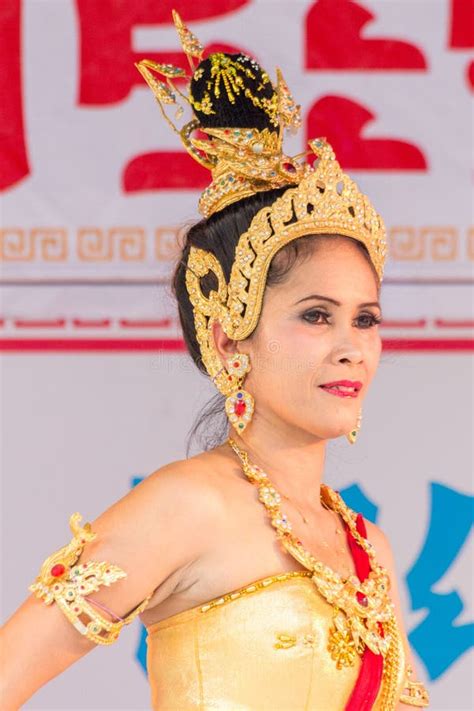 Female Dancer In Traditional Thai Costume In Phuket Town Thailand
