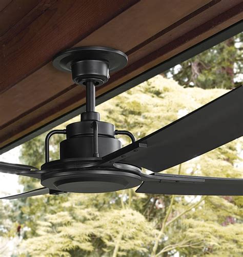 An Outdoor Ceiling Fan Is Hanging From A Wooden Roof Over A Patio Area