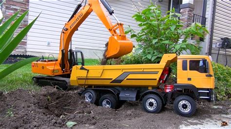 rc adventures  scale earth digger xl excavator   armageddon dump truck youtube