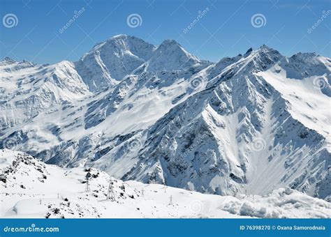 The Snow Capped Peaks Of The Caucasus Mountain Range Stock Photo