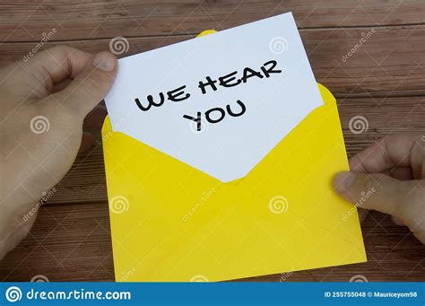 We Hear You Text On White Notepad In Yellow Envelope Listening Concept